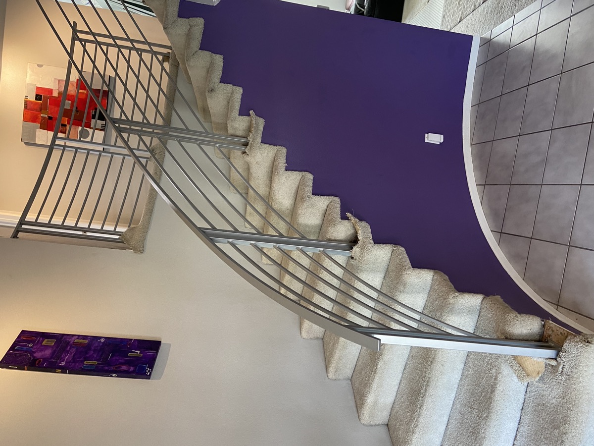 Curved staircase with stainless steel railing