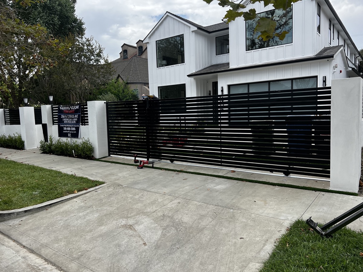 Modern horizontal slat sliding driveway gate in Ventura County