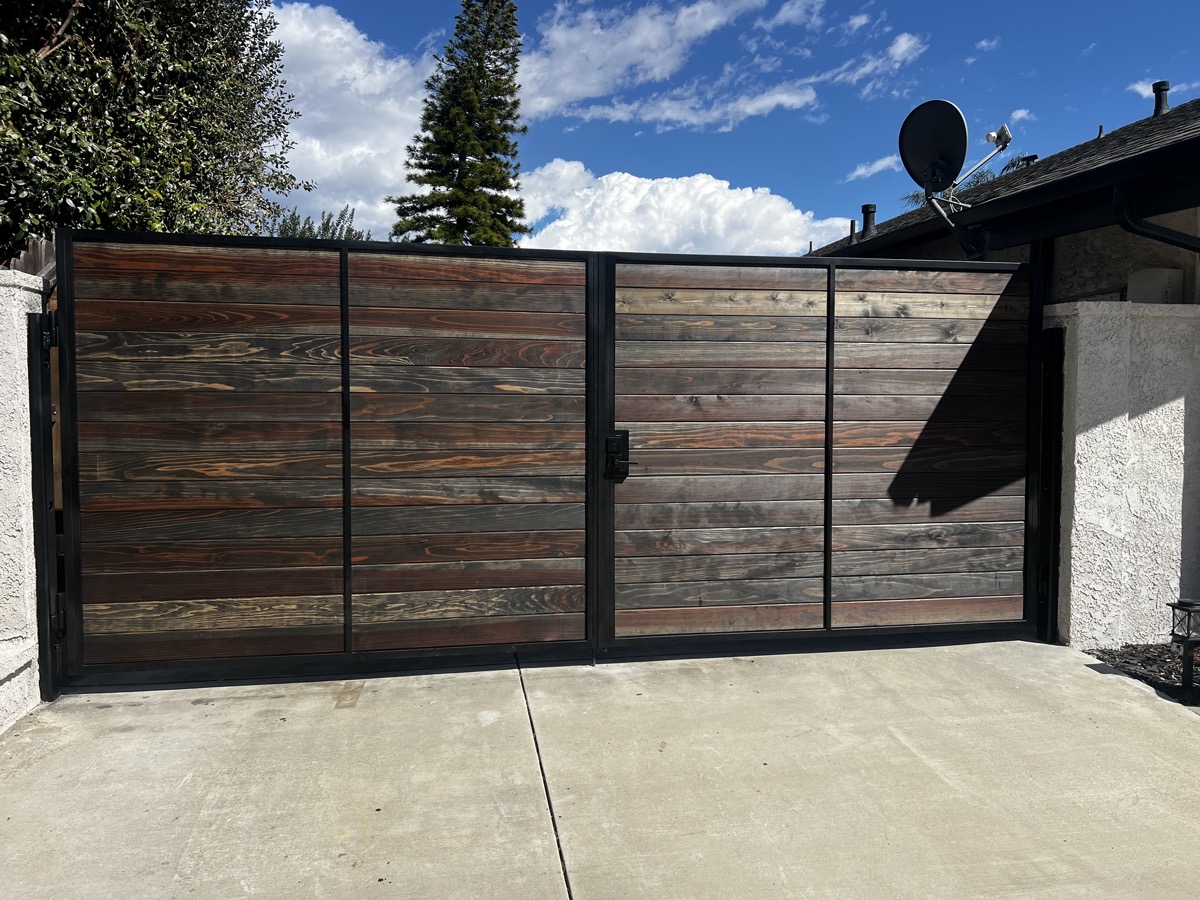 Custom wood and metal driveway gate