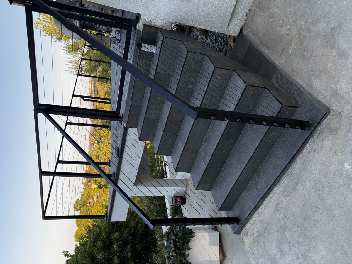 Metal staircase with modern railing