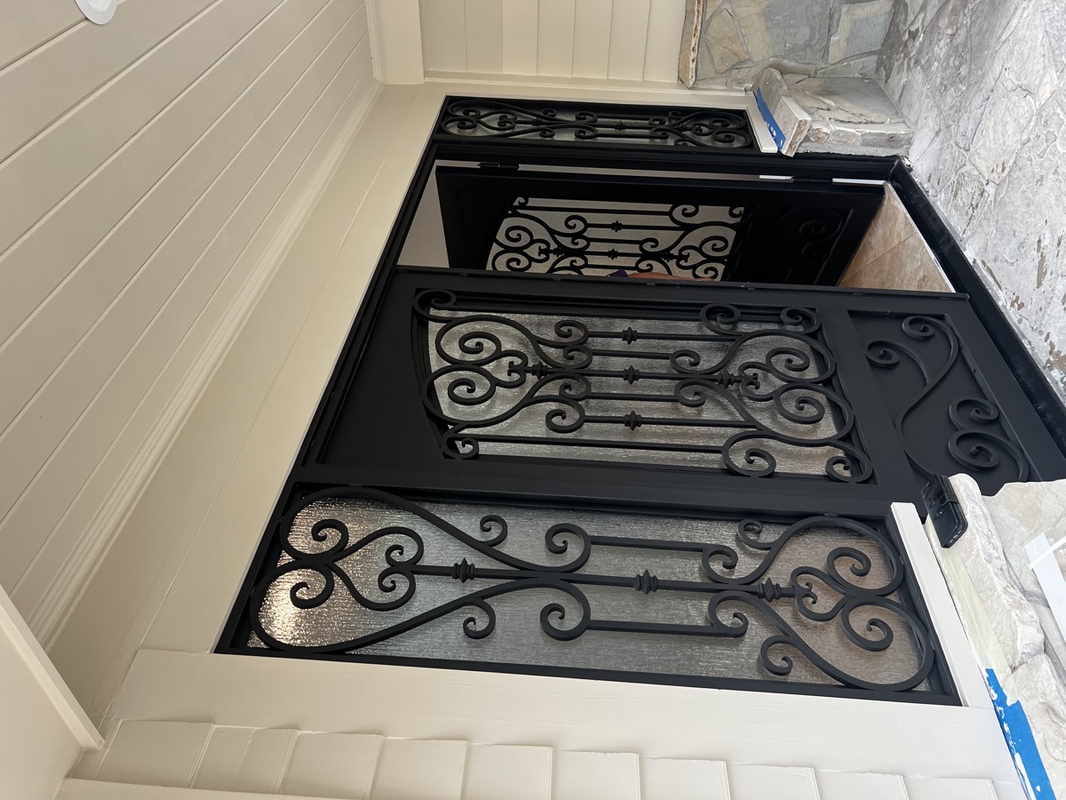 Ornamental iron front door installation