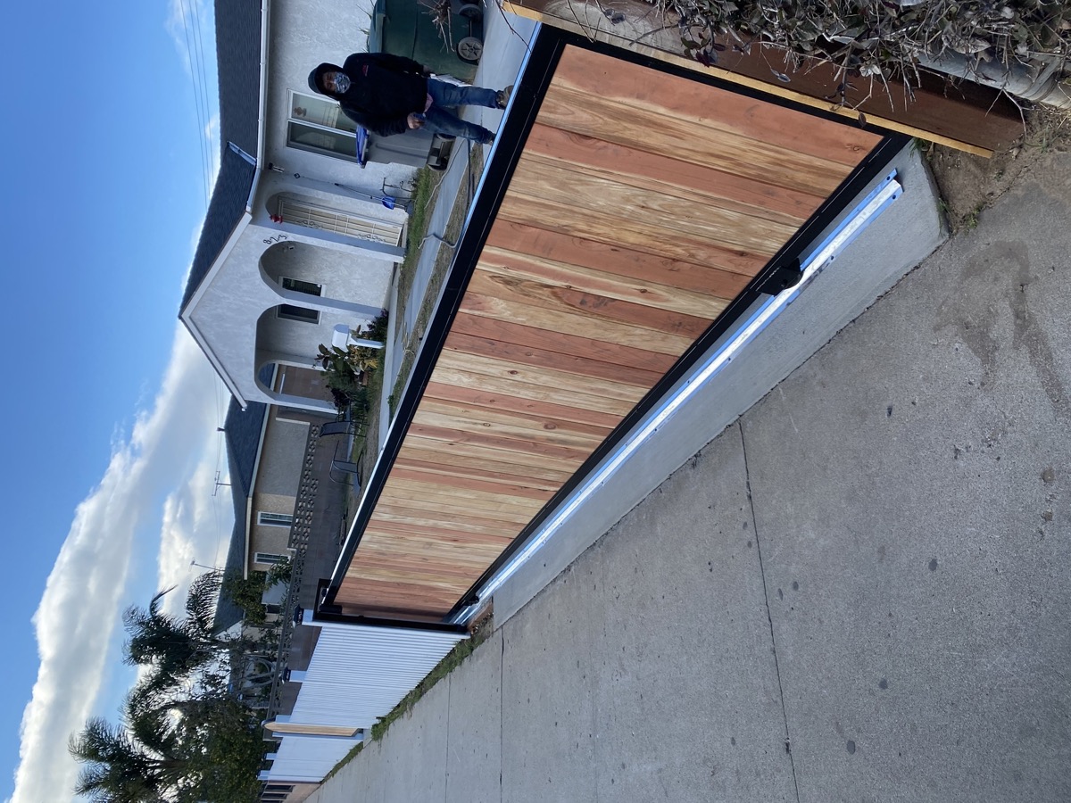 Wood and metal driveway gate