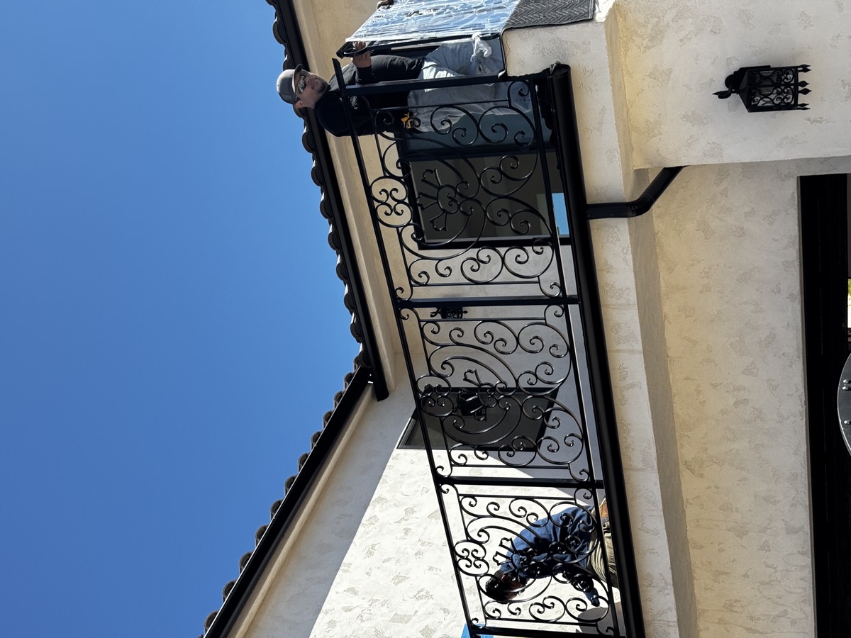 Ornamental balcony railing on Spanish-style home