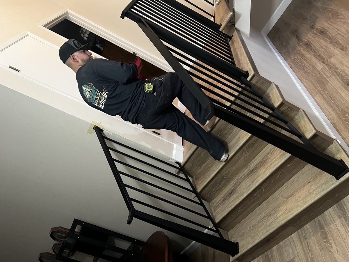 Legendary Metal Works team installing railing