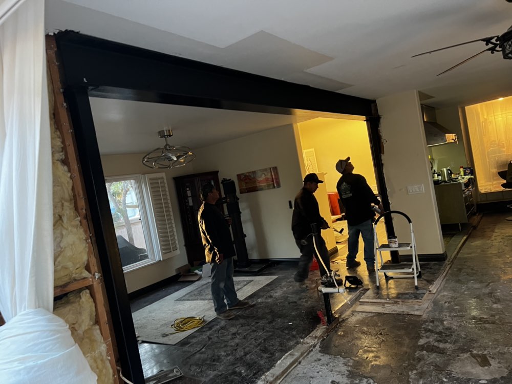 Legendary Metal Works crew installing custom metal door frame in Ventura County home