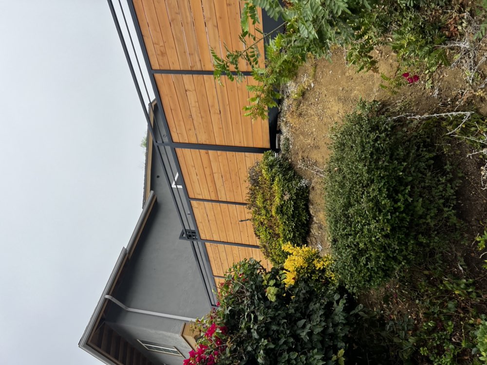 Modern wood and metal privacy fence by Legendary Metal Works in Ventura