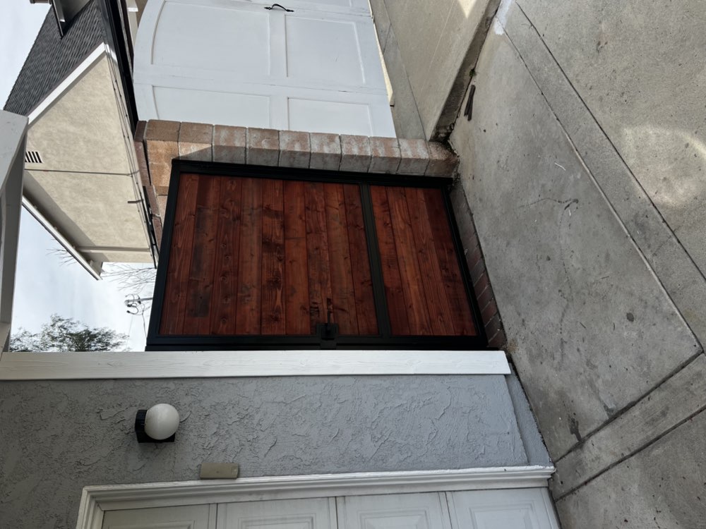 Custom wood and iron side gate by Legendary Metal Works
